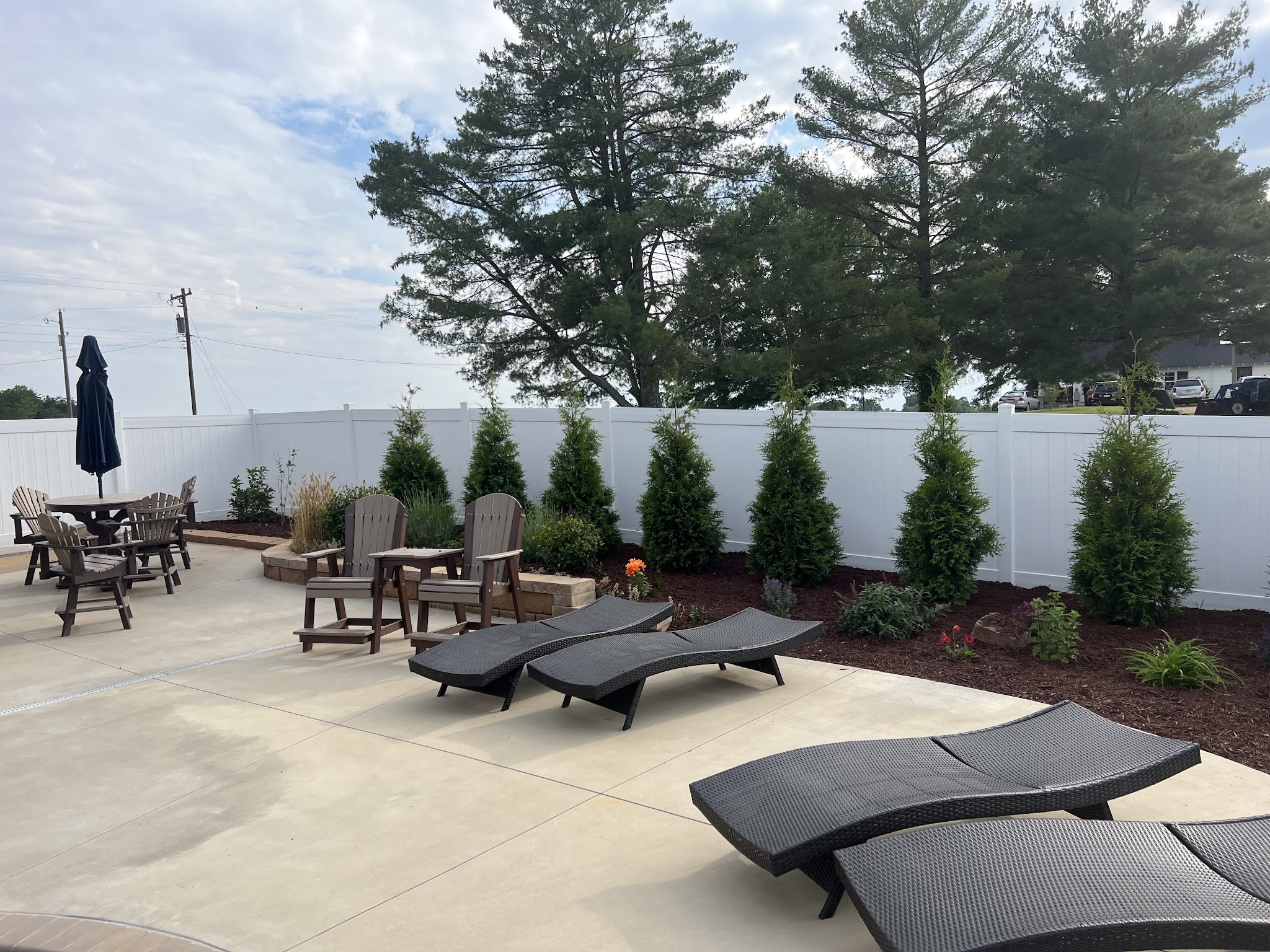 Patio with fresh mulch and new shrubs